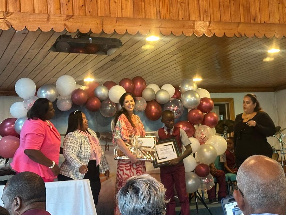 Rhonda L.C. Hull presenting the annual Citizenship Award at James A. Pinder Primary School in Sandy Point, Abaco