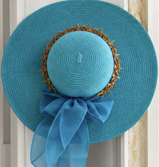 Woven straw sun hat with starfish trim, from the Abaco Art Gallery & Boutique