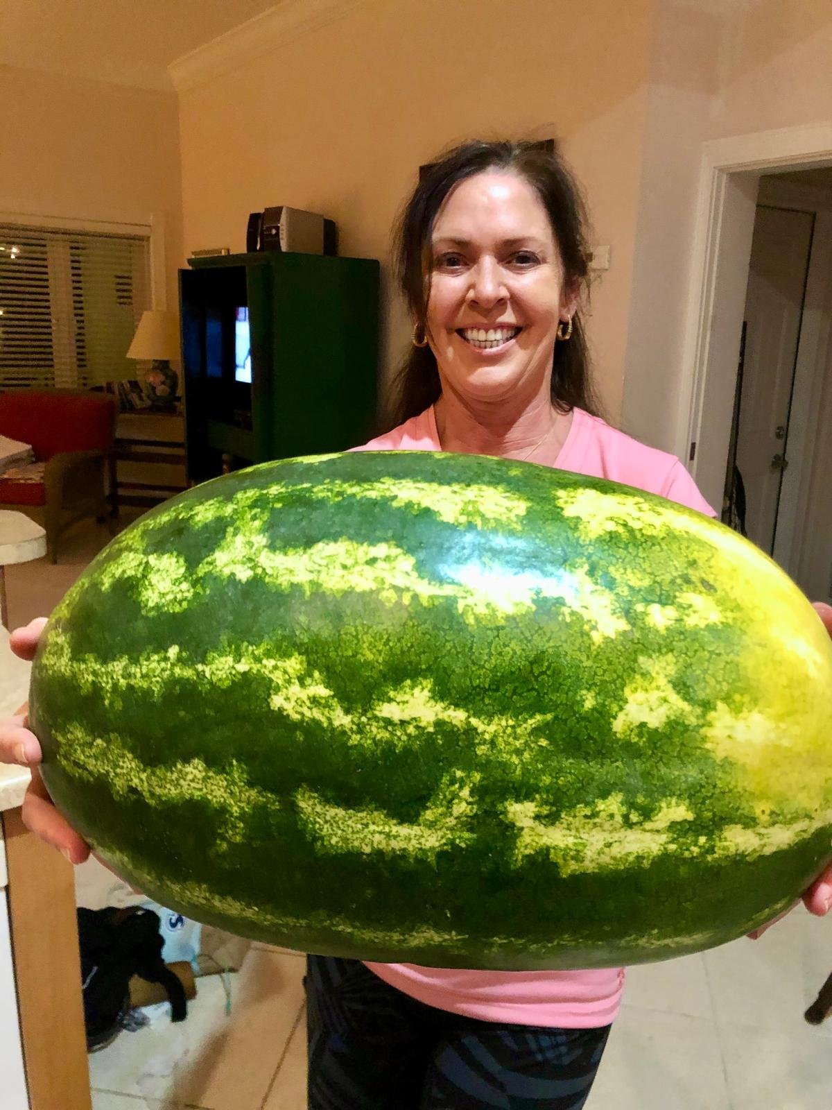 Rhonda L.C. Hull with an enormous homegrown watermelon